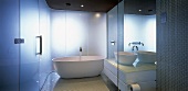 A designer bathroom with a free-standing bathtub