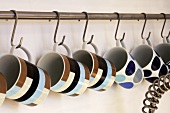 Cups hanging on hooks