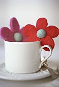 White coffee cup with felt flowers
