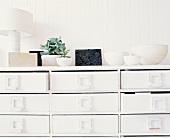A white chest of drawers