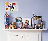 Toys on a chest of drawers in child's bedroom