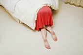 Woman under bed