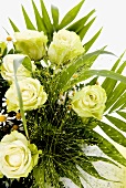 Bouquet of white roses, chamomile flowers and grasses