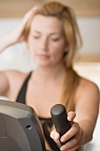 Blond woman working out on crosstrainer