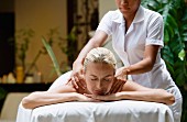 Blonde woman being massaged