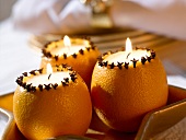 Orange candles with cloves