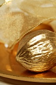 Golden walnut on Christmas plate