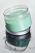 Blue bath salts in a screw-top jar