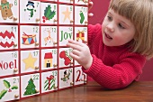 Small girl with Advent calendar