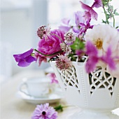 Pink flowers in white vase