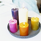 Lighted candles in various colours