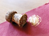 Close-up of champagne cork used as stamp for gift wrap