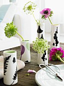 Flowers in china vases decorating table