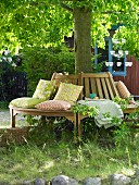 Wooden tree bench with scatter cushions