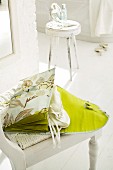 Open, green, silk hosiery bag with separate compartments