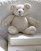 A white knitted teddy bear