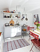 White, wooden, Scandinavian-style summer house with kitchenette