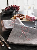 Linen napkins embroidered with twine letters
