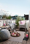 Comfortably furnished roof terrace with candle lantern