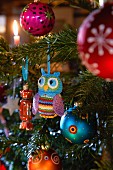 A Christmas tree decorated with a crocheted owl