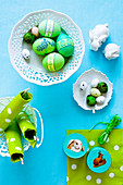 Easter eggs, napkins and boxes with Easter bunny pictures