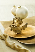 Christmas tree baubles and a cherub as table decoration