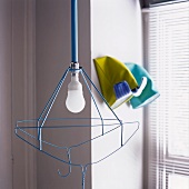 A pendent lamp made of metal coat hangers