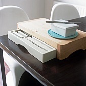 A chopping board with a built-in knife drawer