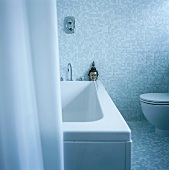 A bathroom with mosaic tiles