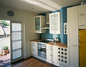 Kitchen in modern rustic style with white fronts