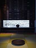 Meditation room with wooden bowl on tatami mat