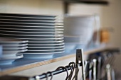 A stack of plates on a shelf