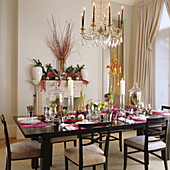 Set dining table, crystal chandelier and festive decorations