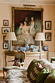 Living room with classical painting, antique furniture and blue porcelain crockery