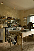 Country kitchen with cooking utensils and rustic charm