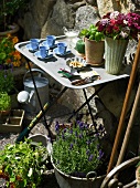 Set side table in a flowering garden