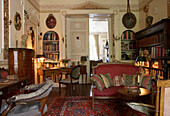 Traditional living room with bookshelves and oriental carpet