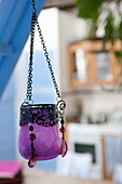 Purple glass lantern with metal chain and pearl decorations