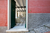 Open front door of a house with a view of the interior