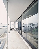 Continuous terrace in front of glass wall
