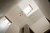 View of a living room ceiling with lamp and skylight