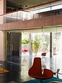 Living space with glass walls & gallery