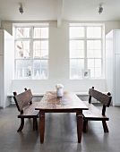 Rustic wooden dining table with benches
