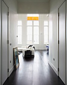 View of living room and sofa through hallway