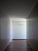 Hallway with white fitted cupboards