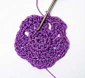 Crocheting a purple flower