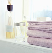 Stack of towels on bathroom windowsill