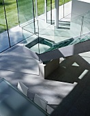 Staircase with glass balustrade in living space