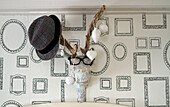 Wall decoration with hat, glasses and Christmas decorations