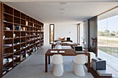 Study with floor-to-ceiling windows and wooden shelves